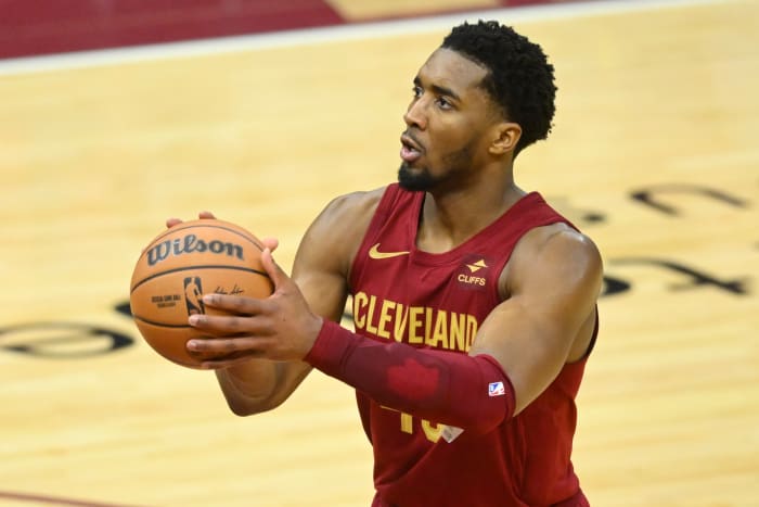 Feb 27, 2024; Cleveland, Ohio, USA; Cleveland Cavaliers guard Donovan Mitchell (45) shoots a free throw in the fourth quarter against the Dallas Mavericks at Rocket Mortgage FieldHouse.